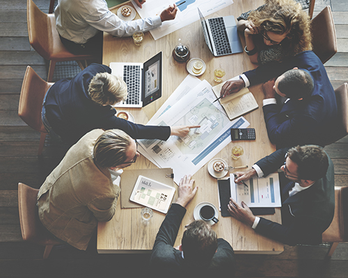 A business meeting in a glass meeting room